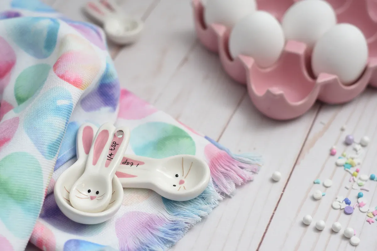 Pastel pink and white Easter egg decorations arranged for spring holiday celebration and radio station event planning