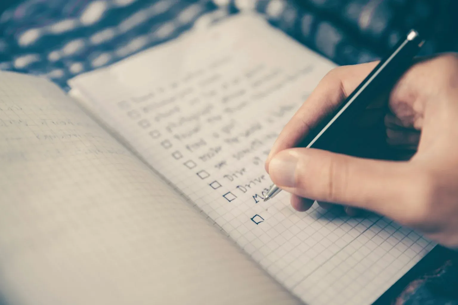 Organized checklist and task management notebook showing systematic content organization approach
